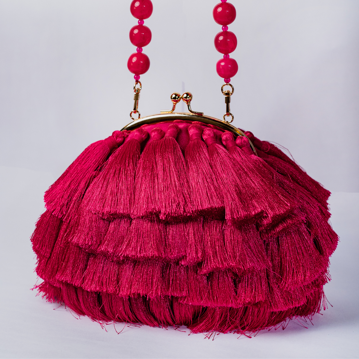 Rani Pink Tassel Clutch