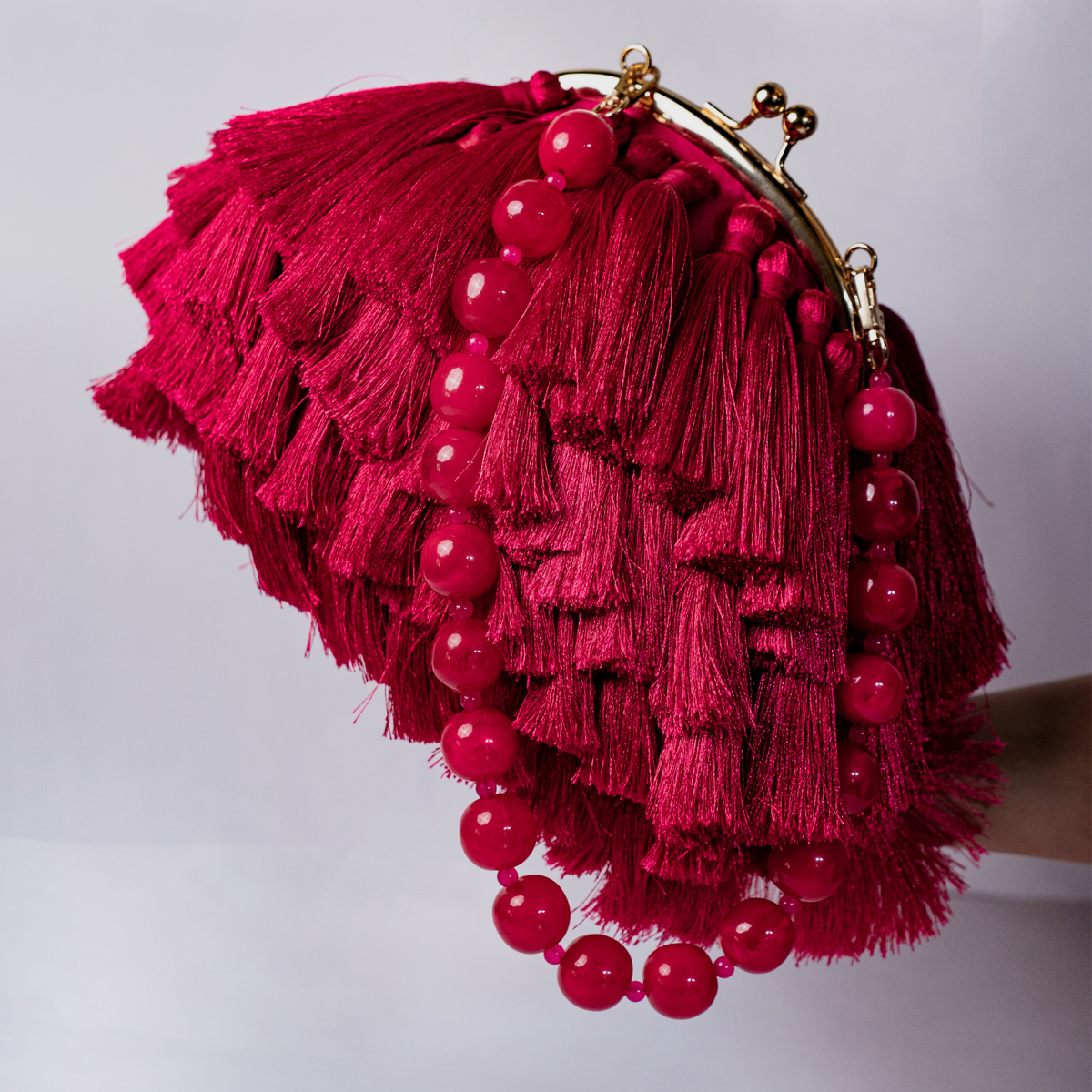 Rani Pink Tassel Clutch